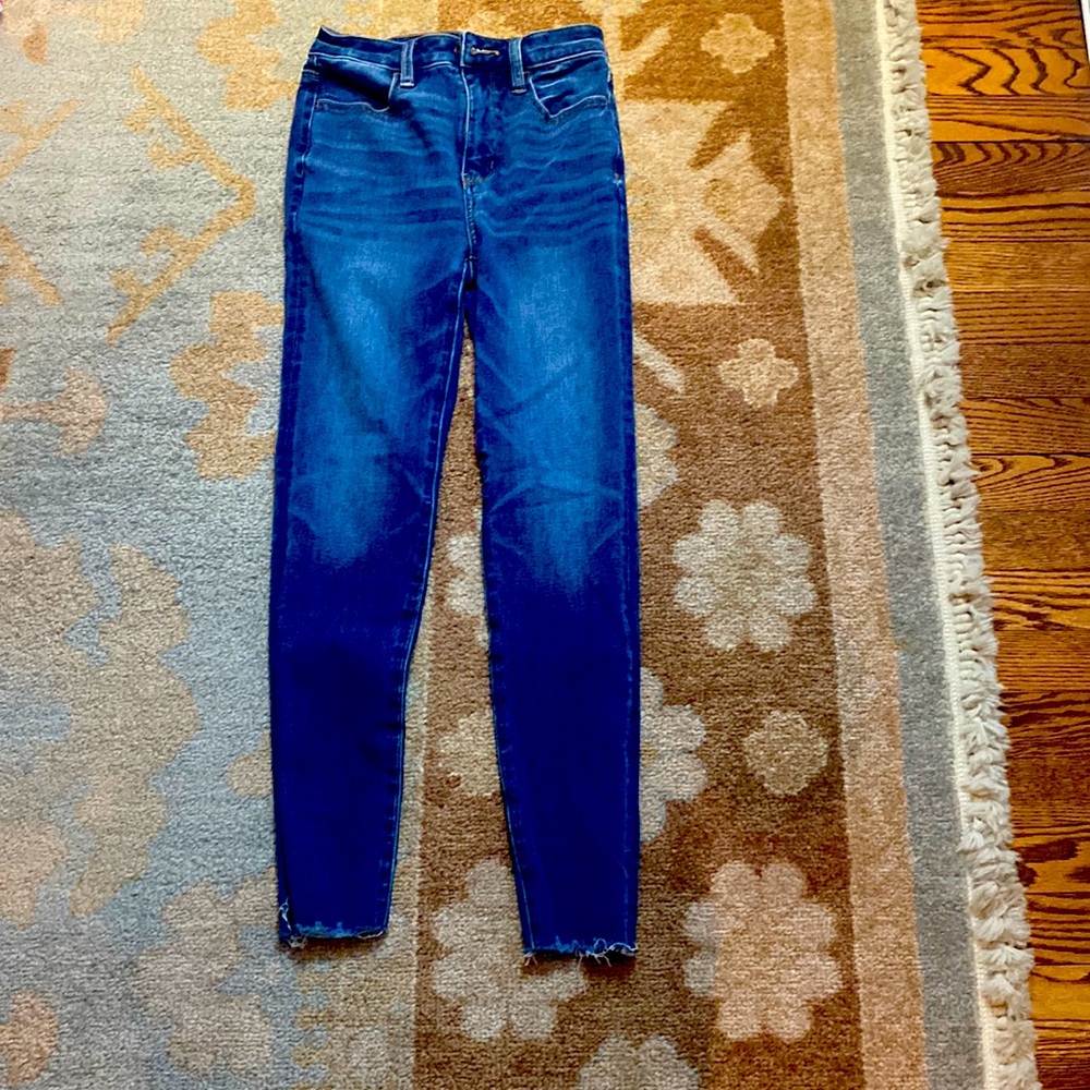 These American Eagle jeans are super high rise frayed at the bottom.